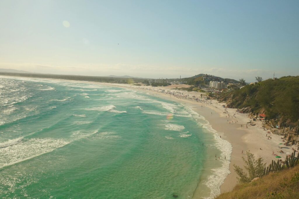 A breathtaking view of Praia Grande beach in Arraial do Cabo, Brazil, showcasing turquoise waters and sandy shores.
